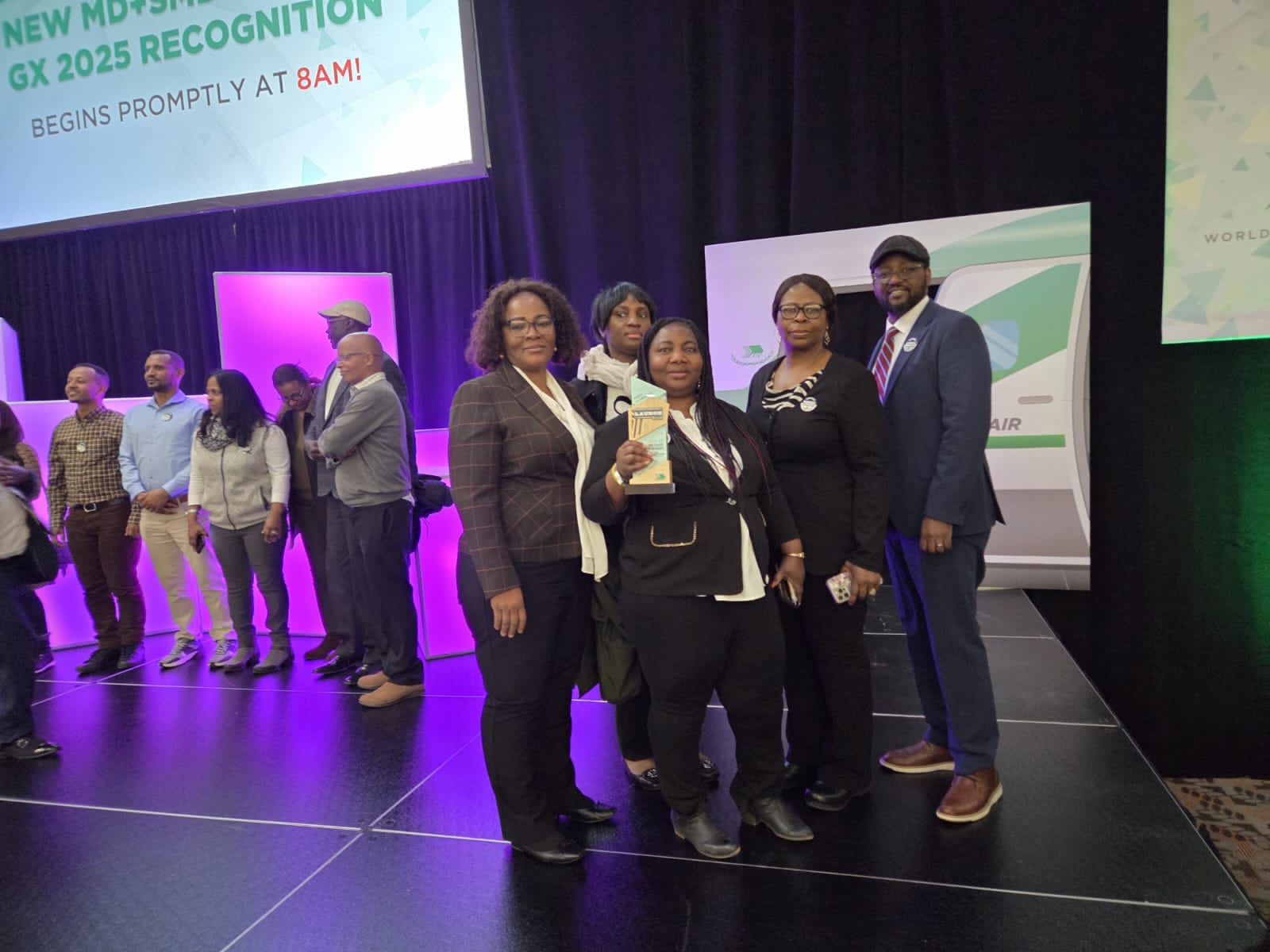 Team receiving MD9 GX 2025 Recognition