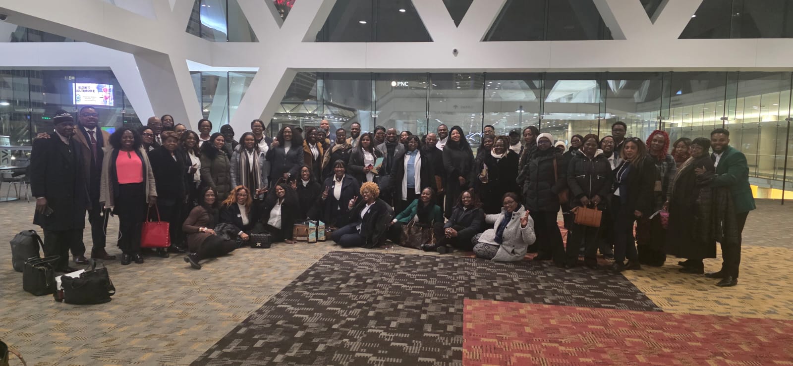 Large team group photo at venue